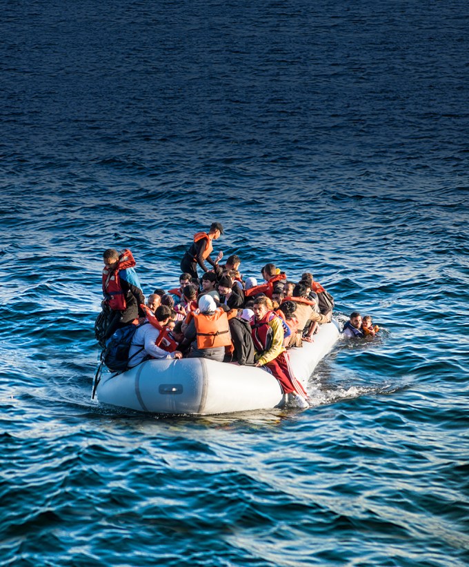 Syrian refugees cross from Turkey to land on a beach on the Greek island of Lesvos. Image shot 06/2015. Exact date unknown.
