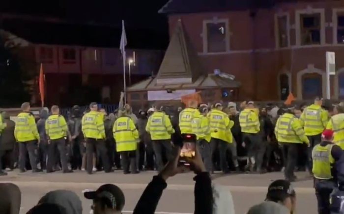 Police contain protesters following an outbreak of communal violence between Hindus and Muslims in Leicester, UK.