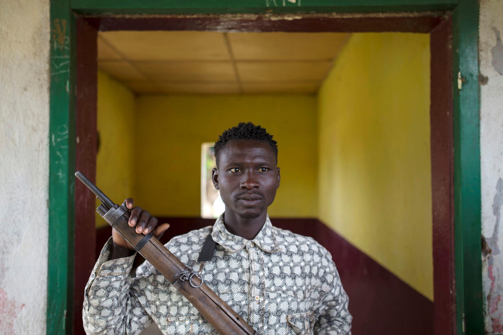 A member of the Anti-Balaka armed militia poses as he displays his weapon in the town of Bocaranga Central African Republic.