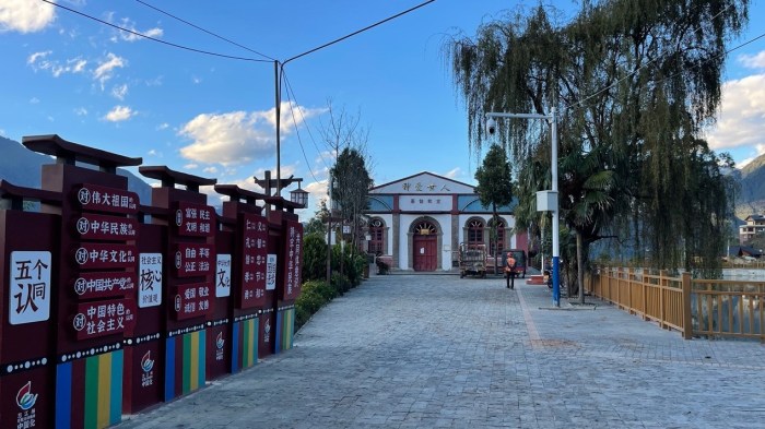 A series of political slogan boards erected outside Laomudeng Church in Yunnan, China.